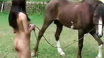 Sexy brunette plays dirty games with a horse