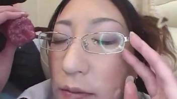 Woman engaging in sexual activity with two dogs
