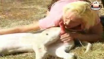 Curvy blonde bangs an animal outside