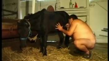 Handsome guy copulates with beast in the ancient shed